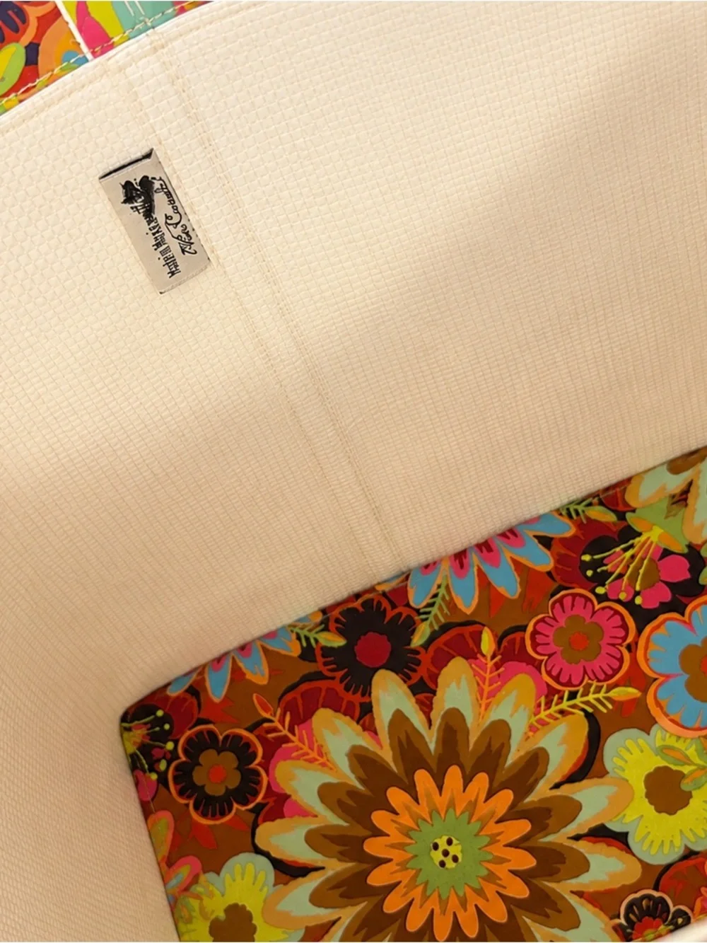 Consuela full size vinyl tote in retro print. Like new.  Flat rectangular base.